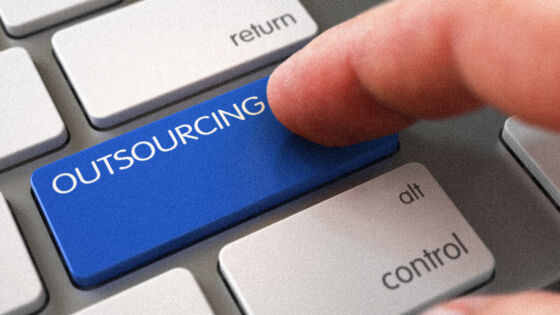 a blue button that says outsourcing on a keyboard