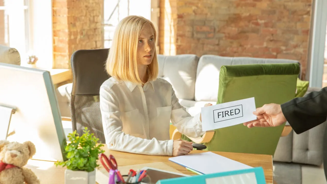 Young Businesswoman Fired, Looks Upset