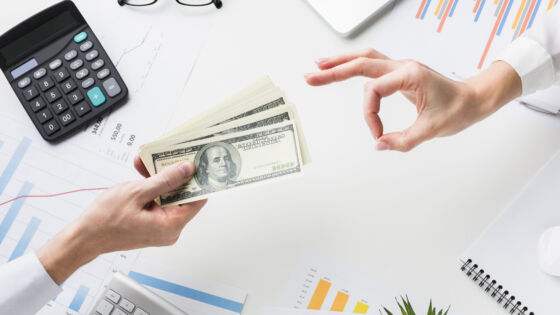 Top View Hand Accepting Money Desk
