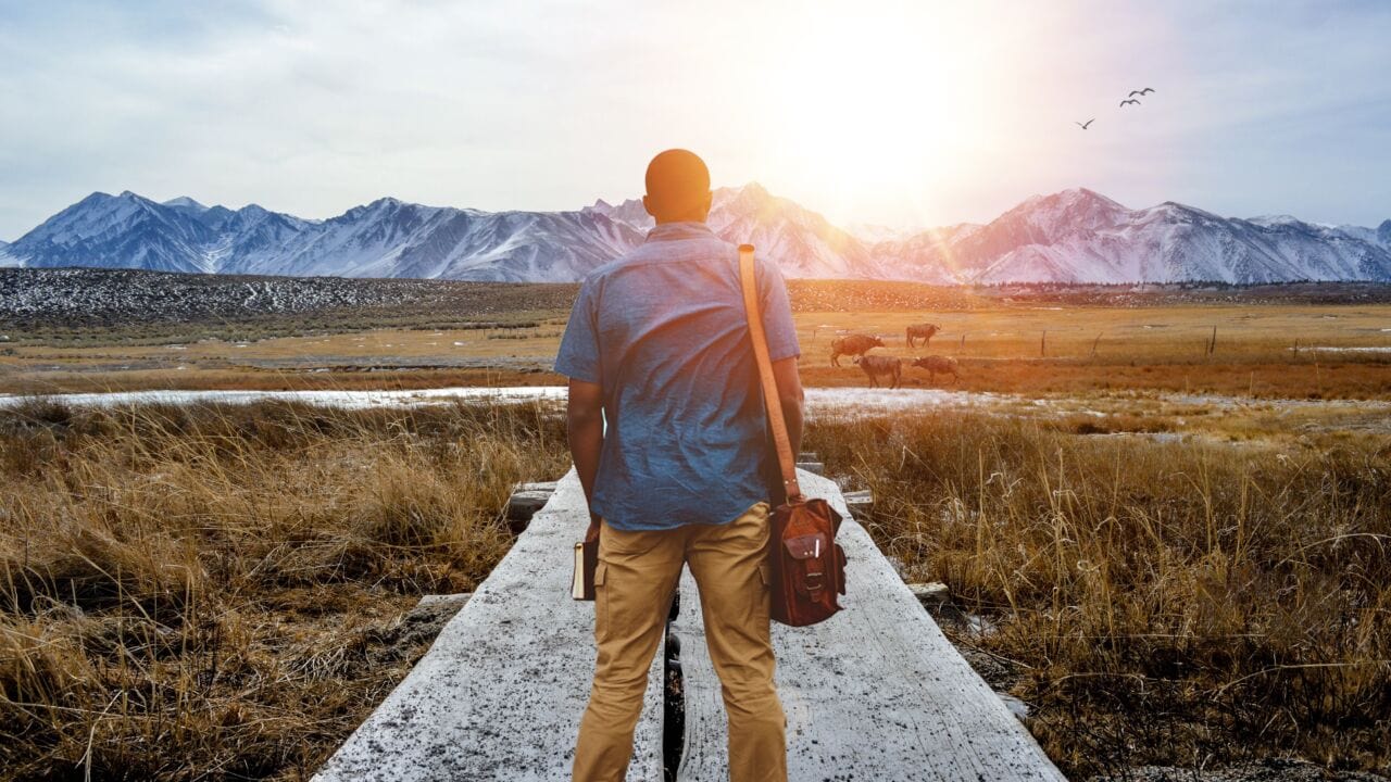 Shallow Focus From Behind Of A Male Standing On A Pathway In The Middle Of A Grassy Field Shallow Focus From Behind Of A Male Standing On A Pathway In The Middle Of A Grassy Field