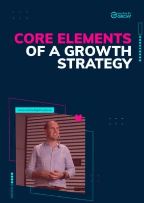 a man standing in front of a screen with the words core elements of a growth