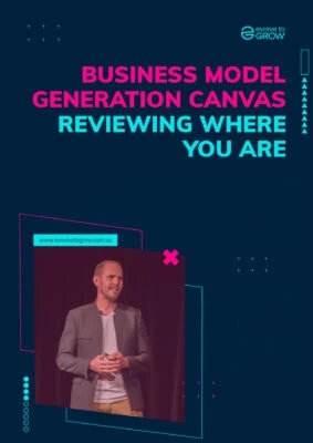 a man standing in front of a screen with the words business model generation canvass
