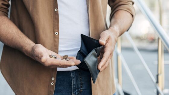 Close Up Hands Holding Wallet Coins